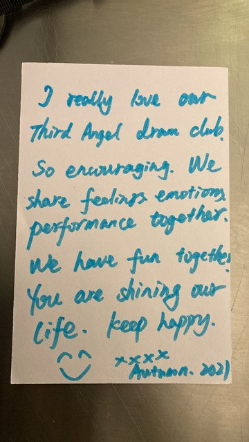 A feedback form written in blue ink: I really love our Third Angel drama club. So encouraging. We share feelings, emotions, performance together. We have fun together. We are shining our life. Keep happy. Smiling face. Kisses. Autumn 2021.